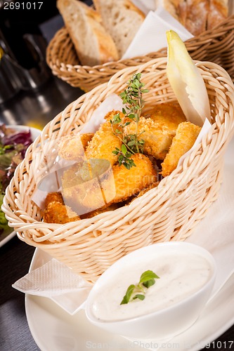 Image of Crumbed chicken nuggets in a basket