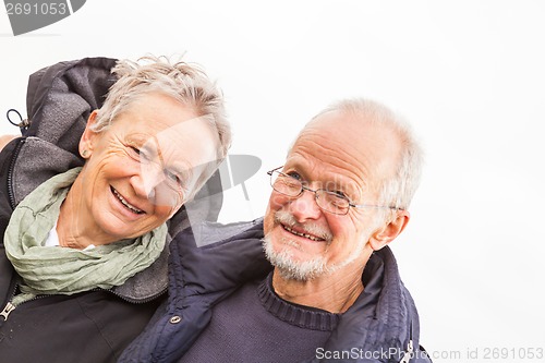 Image of happy mature couple relaxing baltic sea dunes 