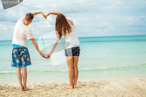 Image of smiling young couple having fun in summer holiday