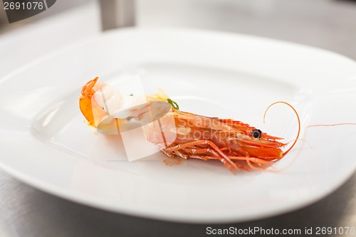 Image of Chef plating up seafood pasta