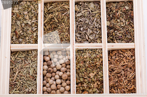 Image of Tray with assorted dried spices and herbs