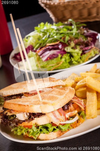 Image of Club sandwich with potato French fries