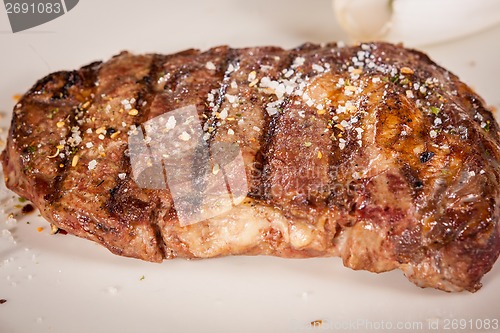 Image of Grilled beef steak with seasoning