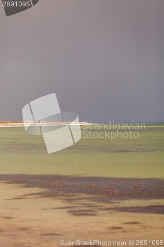 Image of baltic sea background evening wooden wave breaker beach