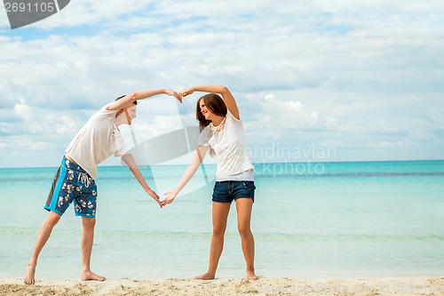 Image of smiling young couple having fun in summer holiday