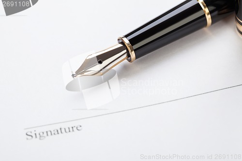 Image of macro closeup sign document contract pen filler 