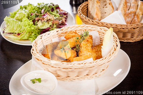 Image of Crumbed chicken nuggets in a basket