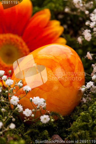 Image of Vivid orange Easter egg with a gerbera and rose