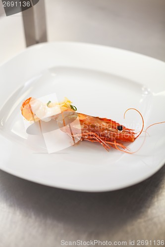 Image of Chef plating up seafood pasta