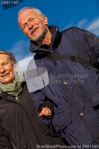 Image of happy mature couple relaxing baltic sea dunes 