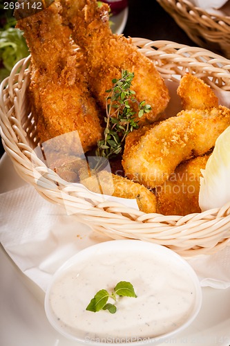 Image of Crisp crunchy golden chicken legs and wings