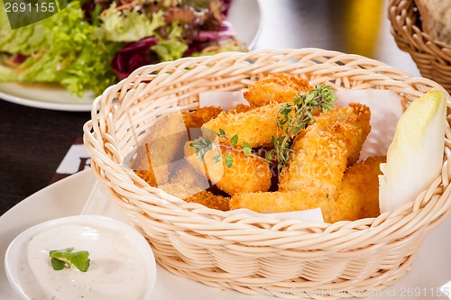 Image of Crumbed chicken nuggets in a basket