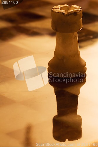 Image of  abstrac gold tower in a chess board
