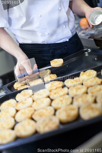 Image of Chef preparing desserts removing them from moulds