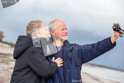 Image of Elderly couple taking a self portrait