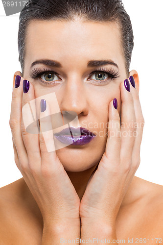 Image of Graceful attractive woman with purple lips and nails