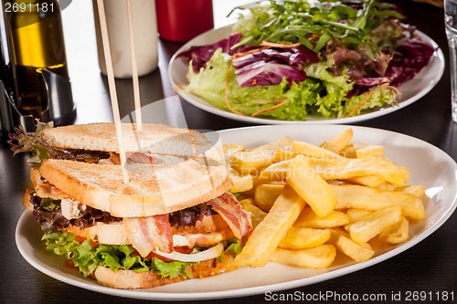 Image of Club sandwich with potato French fries