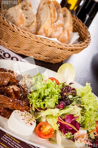 Image of grilled beef stripes fresh salad and goat cheese