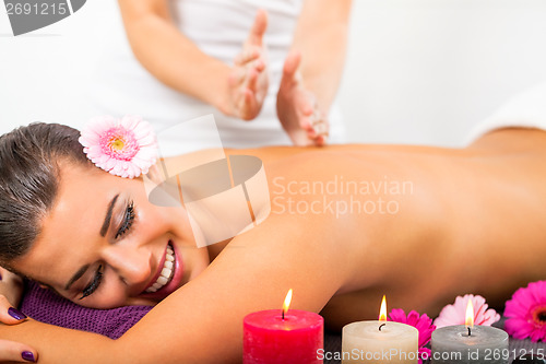 Image of Beautiful woman having a back massage