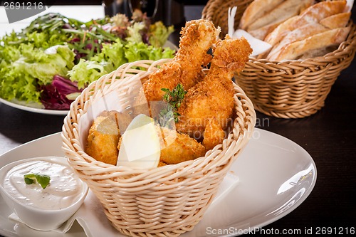 Image of Crisp crunchy golden chicken legs and wings