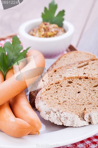 Image of tasty sausages frankfurter with grain bread 