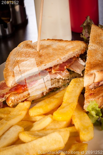 Image of Club sandwich with potato French fries