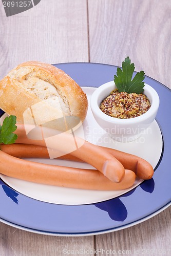 Image of tasty sausages frankfurter with grain bread 