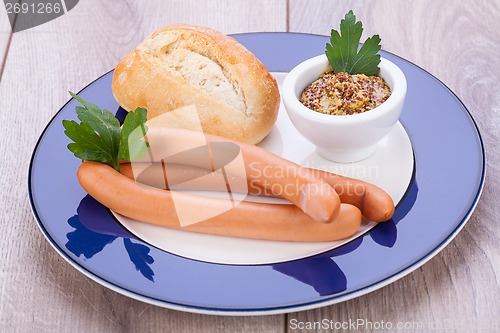 Image of tasty sausages frankfurter with grain bread 