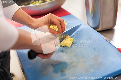 Image of Chef chopping salad ingredients