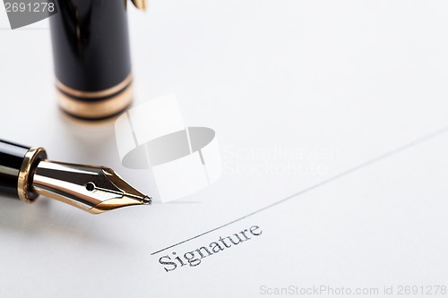 Image of macro closeup sign document contract pen filler 