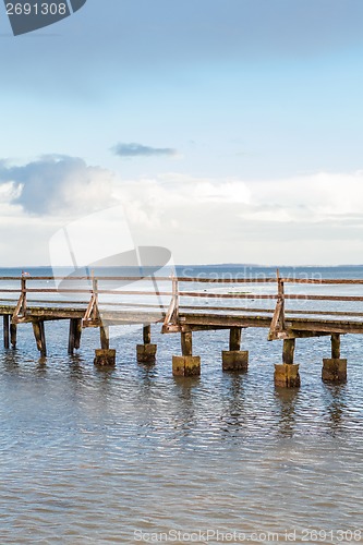 Image of Bridge or pier across an expanse of sea