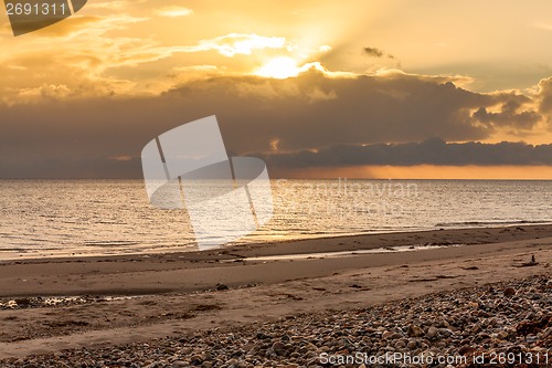 Image of baltic sea background evening wooden wave breaker beach