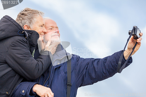 Image of Elderly couple taking a self portrait