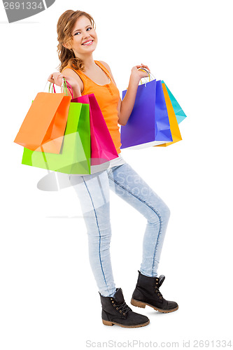 Image of attractive young woman with colorful shopping bags