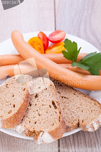 Image of tasty sausages frankfurter with grain bread 