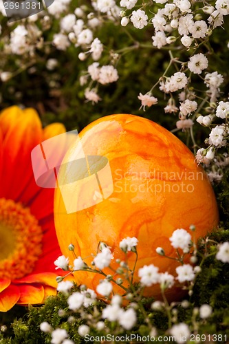 Image of Vivid orange Easter egg with a gerbera and rose