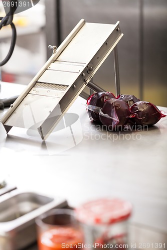 Image of Chef slicing boiled beetroot