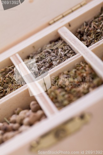 Image of Tray with assorted dried spices and herbs