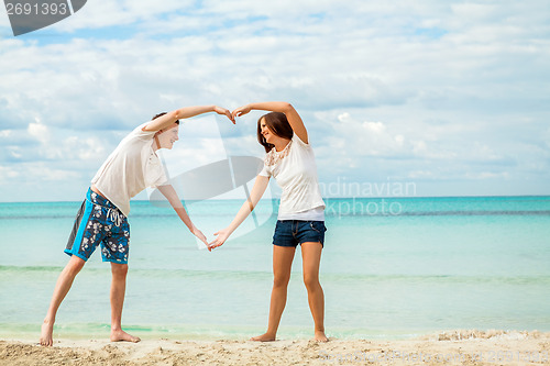 Image of smiling young couple having fun in summer holiday