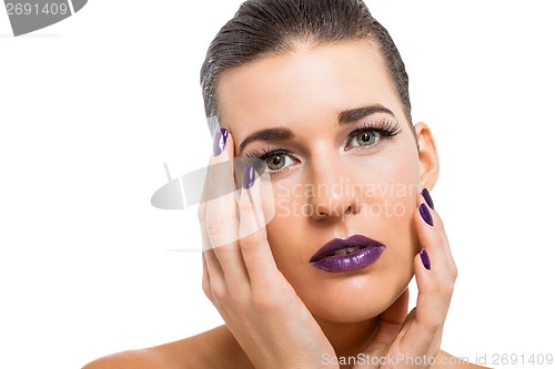 Image of Graceful attractive woman with purple lips and nails
