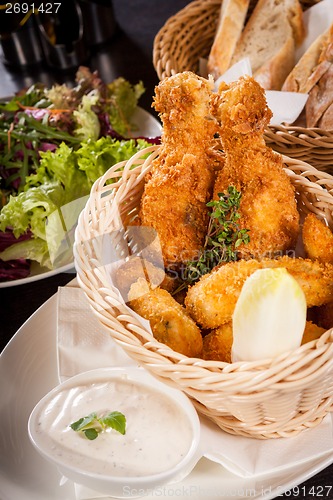 Image of Crisp crunchy golden chicken legs and wings