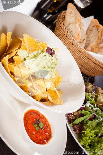 Image of Crisp corn nachos with guacamole sauce