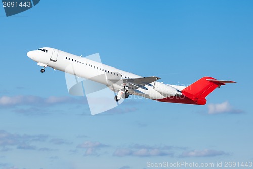 Image of Commercial airliner flying midair after takeoff