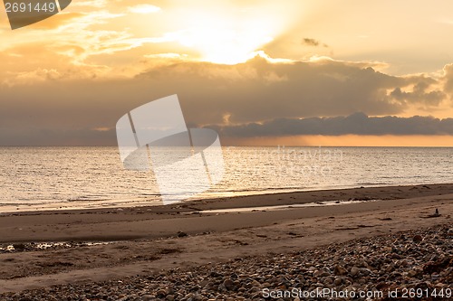 Image of baltic sea background evening wooden wave breaker beach