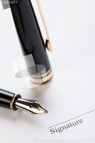 Image of macro closeup sign document contract pen filler 