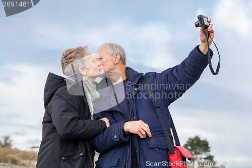 Image of Elderly couple taking a self portrait