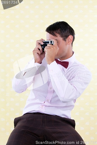 Image of Retro Male with Rangefinder Camera