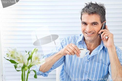 Image of Happy Man Receiving Phone Call