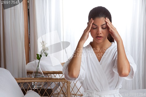 Image of Young Woman Massaging her Face