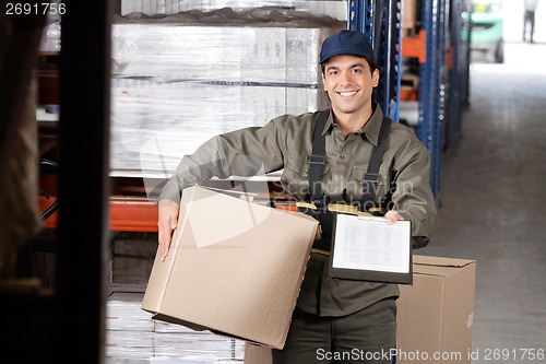 Image of Male Supervisor With Clipboard And Cardboard Box